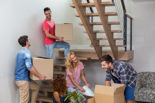 Removalists loading furniture during a house move in Kilburn