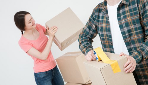 Packed boxes and furniture ready for relocation in Kilburn