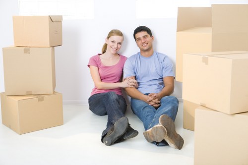 Removal van and moving team in a Kilburn residential street