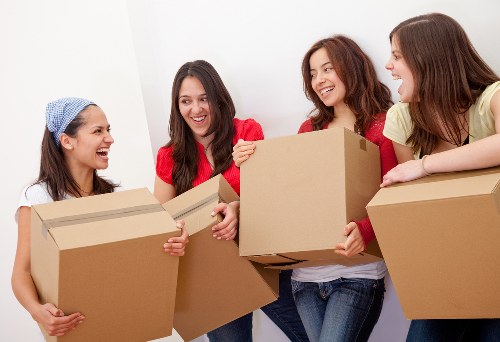 Packed office boxes and furniture ready for transport