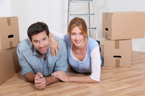 Removal crew handling office items in a Kilburn business property