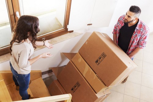 Packed boxes and furniture ready for transport in Kilburn