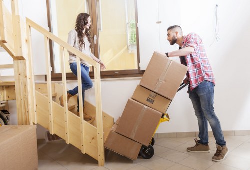 Team handling flat removals in a Kilburn apartment building