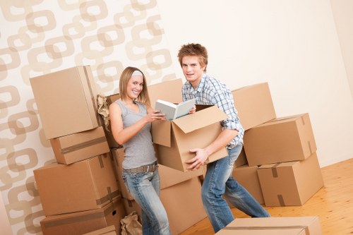 Local removal service preparing items for transport in Kilburn