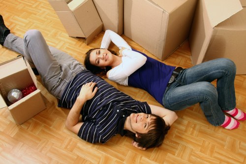 Furniture being carried through a home doorway during a Kilburn move
