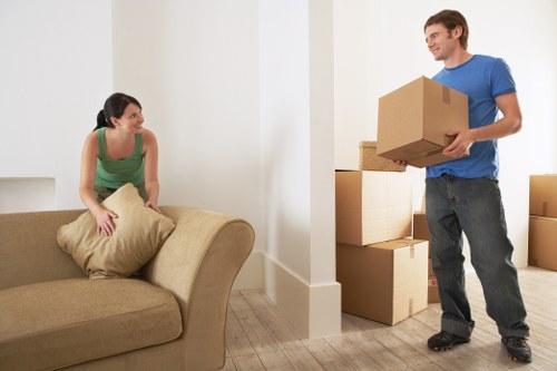 Loading furniture into a removal van near Kilburn homes